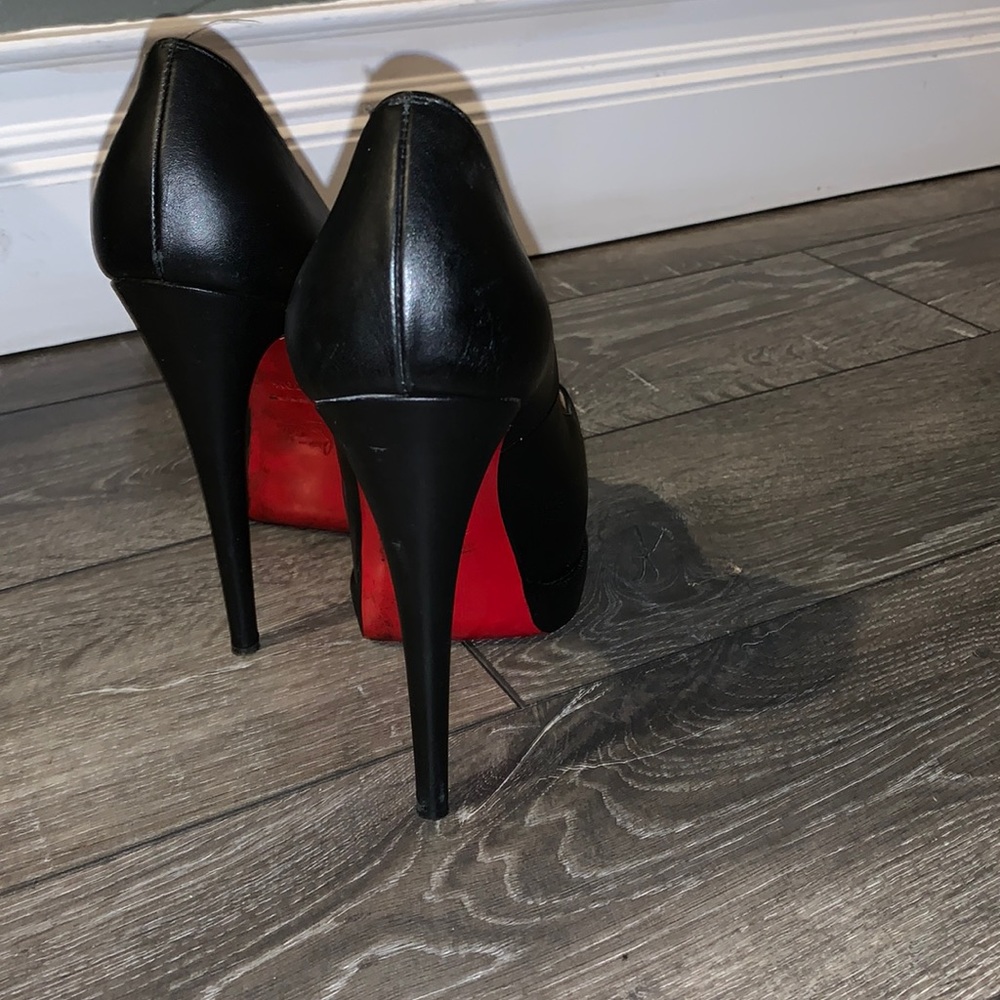 Very worn Christian Louboutin Red Bottoms